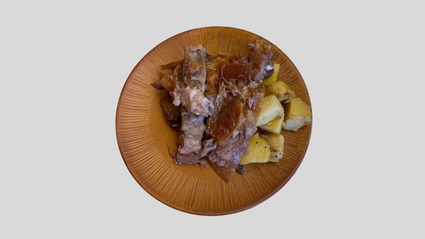 Agnello con patate al forno